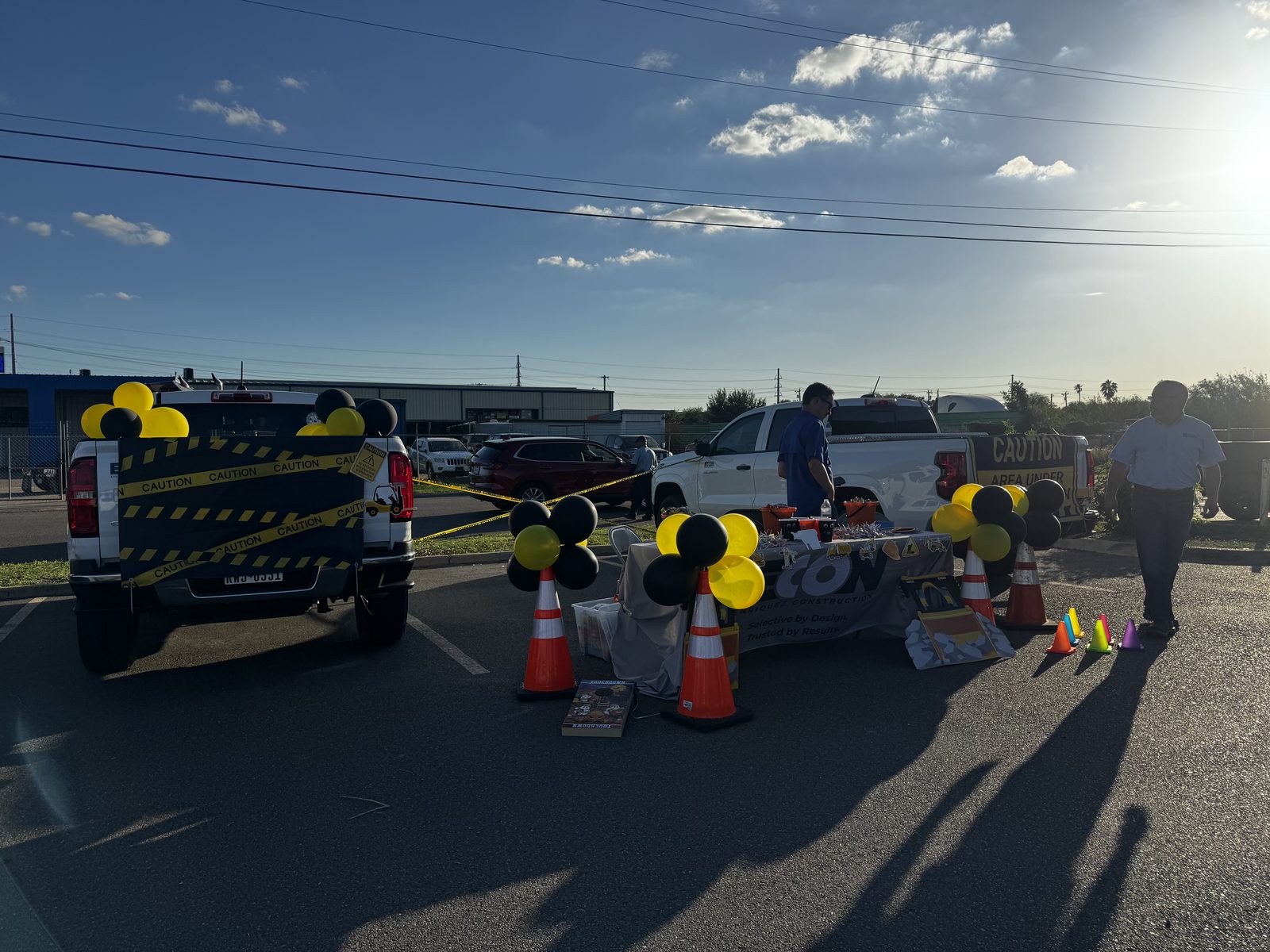 E-CON Group trucks and candy table decorated for Trunk or Treat at Rio Grande Valley College, Pharr, TX