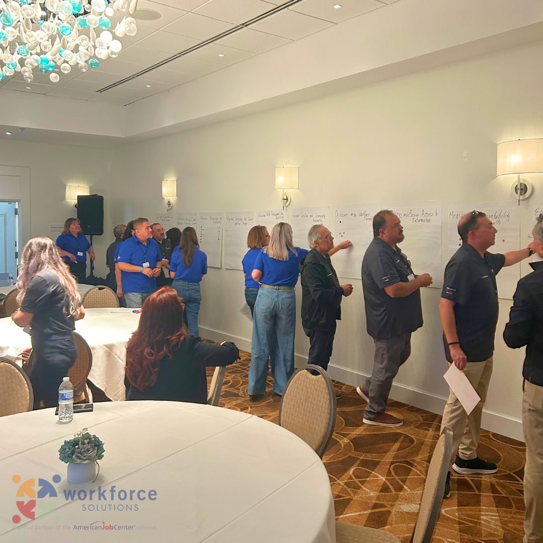 Workforce Solutions board members, including E-CON Group President Gilbert Enriquez, voting on regional workforce priorities at a planning summit on South Padre Island, TX