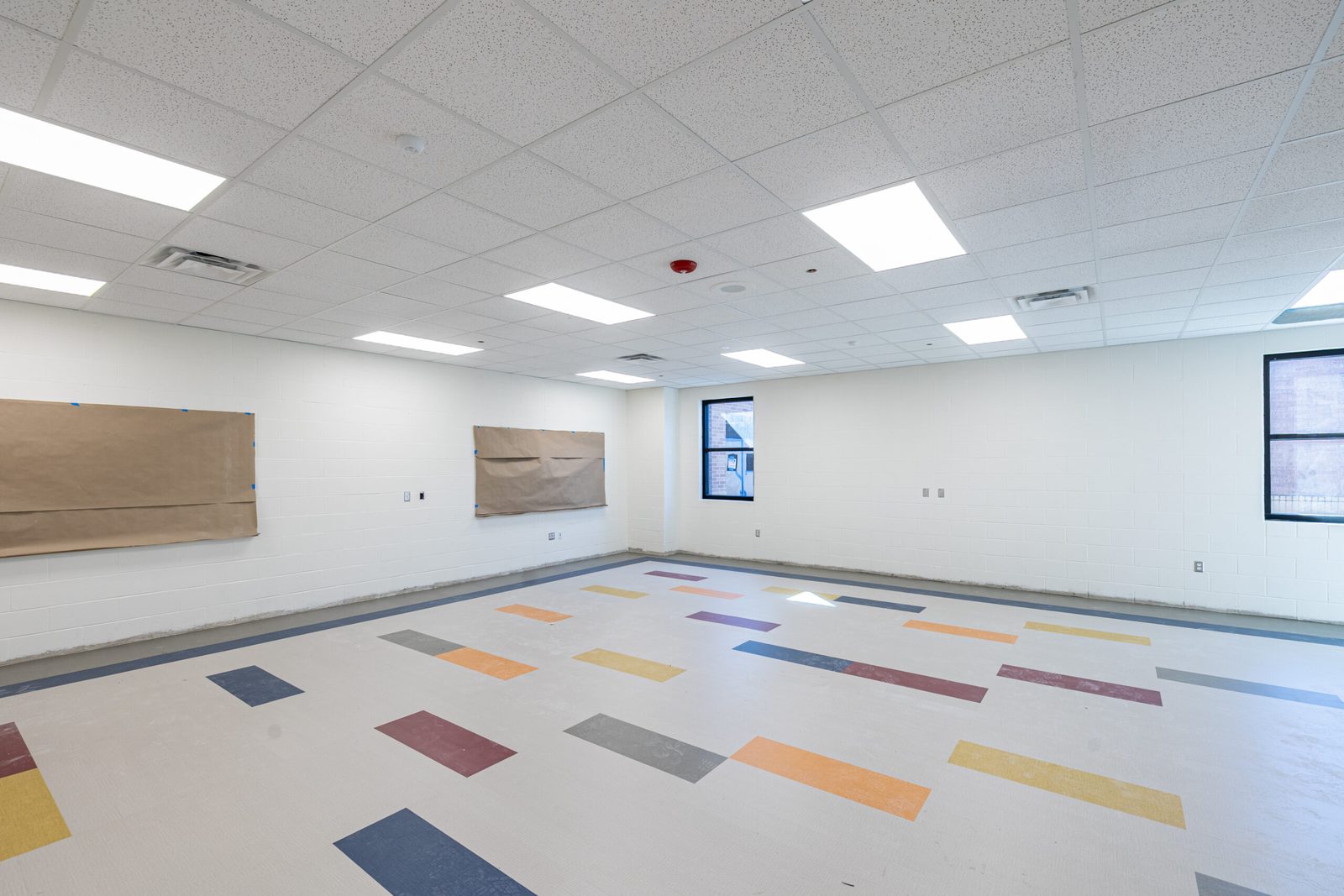 Finished classroom with colored flooring at a Donna ISD elementary addition, Rio Grande Valley, by E-CON Group