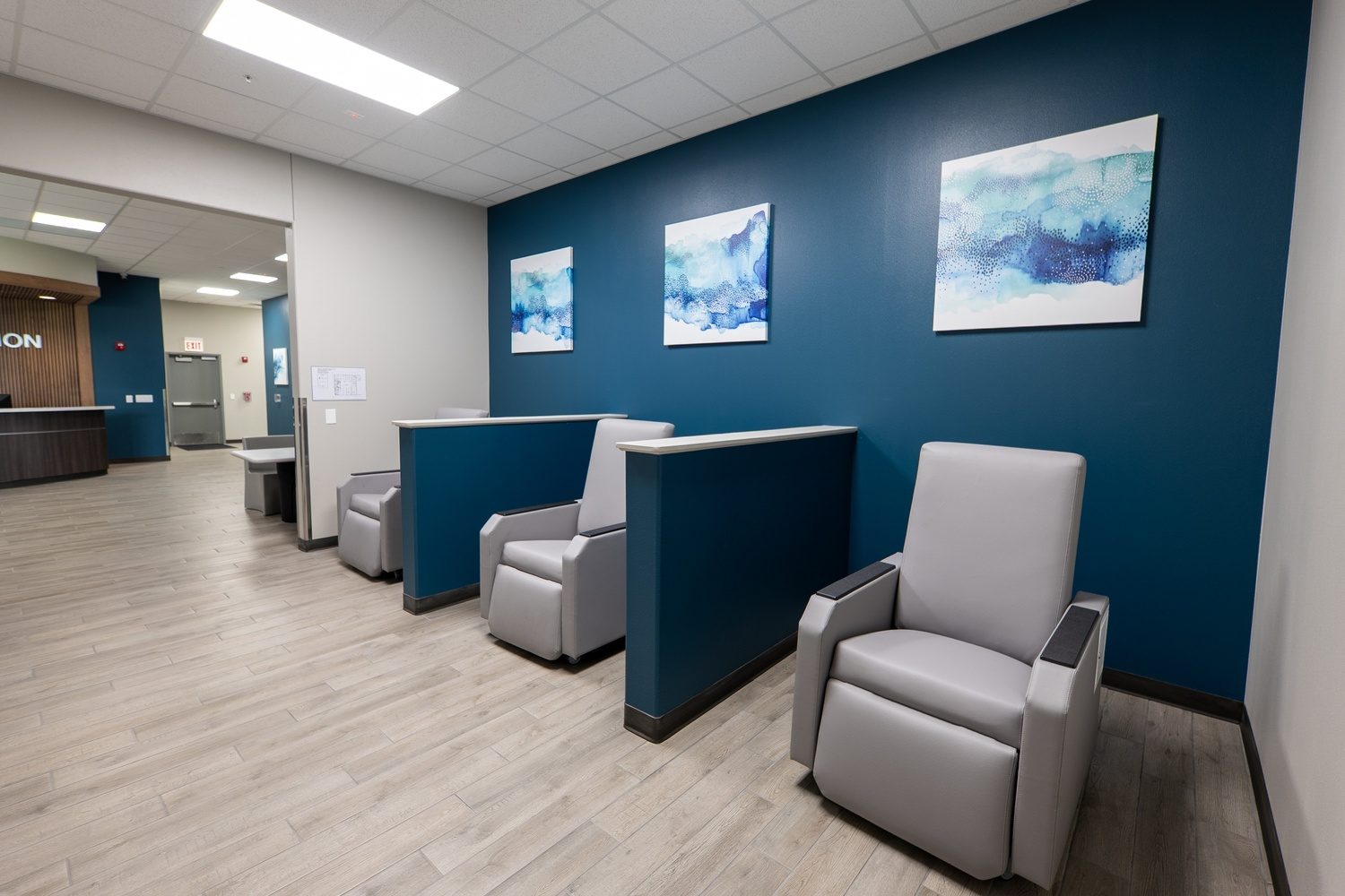 Waiting area with blue feature wall at TTBH Tropical Plaza in Edinburg, TX, constructed by E-CON Group